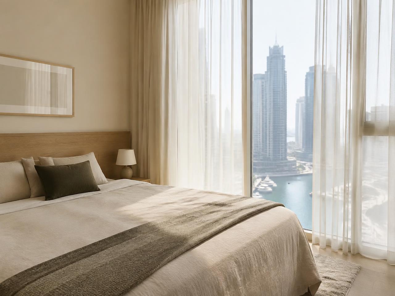 Marina One bedroom with sheer curtains and oak headboard